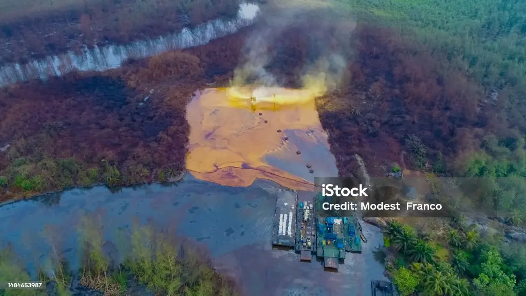 Oil polluted river in the Niger Delta showing the devastating effects of the Nigerian oil spill